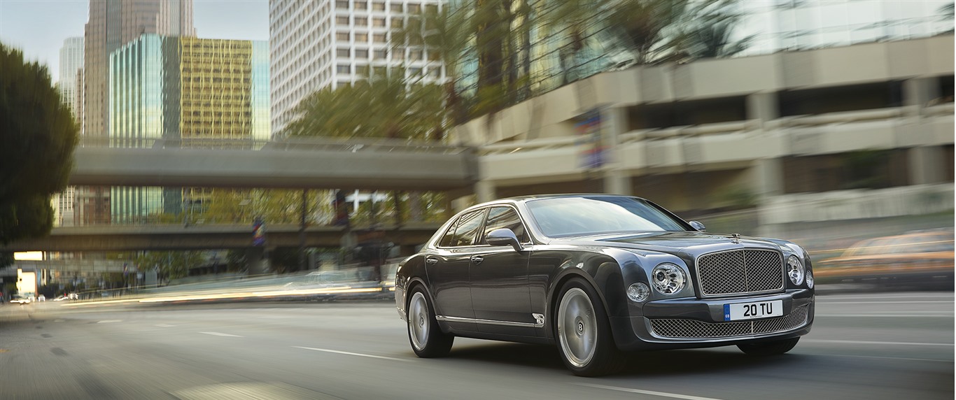 Bentley driving around a city like Palm Beach