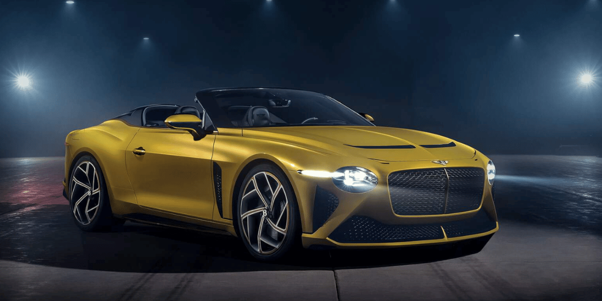 A Yellow Bentley Bacalar under showlights.