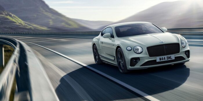 Bentley Continental GT driving down a highway.